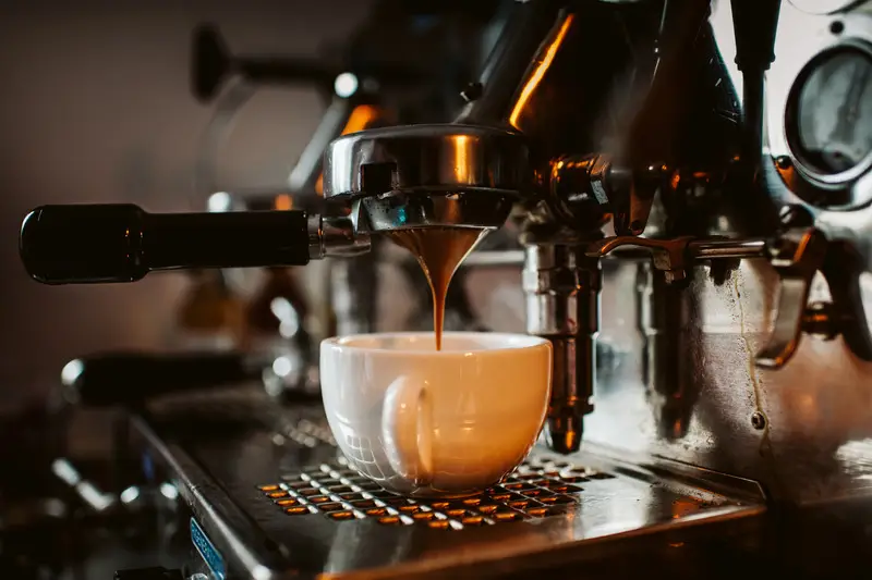 Espresso machine brewing fresh coffee into a cup.